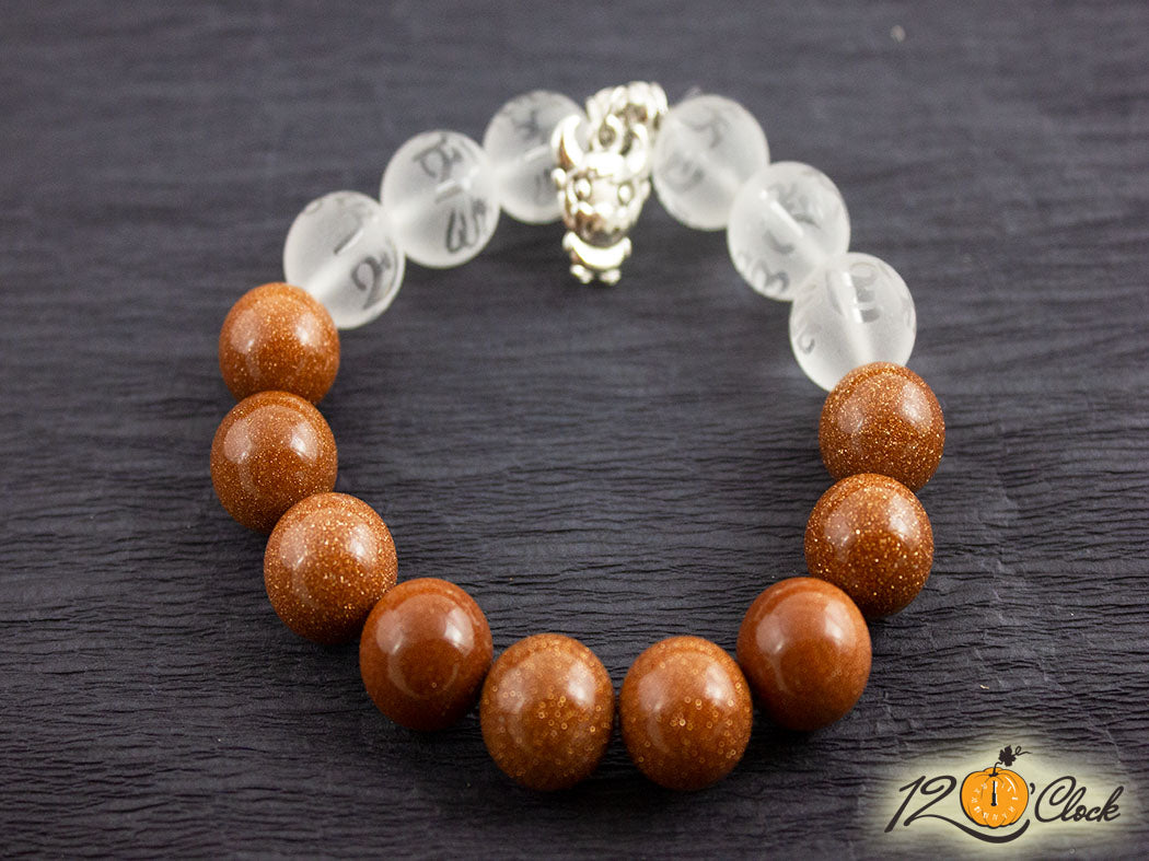 Гривна "Годината на металния бик" -кафяв слънчев камък и планински кристал с йероглифи